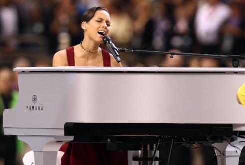 Alicia Keys and her piano performing her rendition of the "National Anthem"
